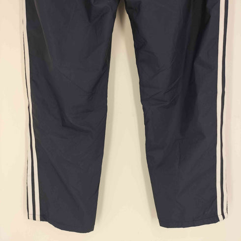 アディダス adidas 24SS スリーストライプス ルーズフィット テーパードレッグ オープンヘム WIND RDY ウインドパンツ メンズ JPN:M
