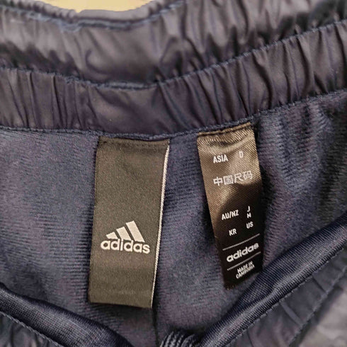 アディダス adidas 24SS スリーストライプス ルーズフィット テーパードレッグ オープンヘム WIND RDY ウインドパンツ メンズ JPN:M