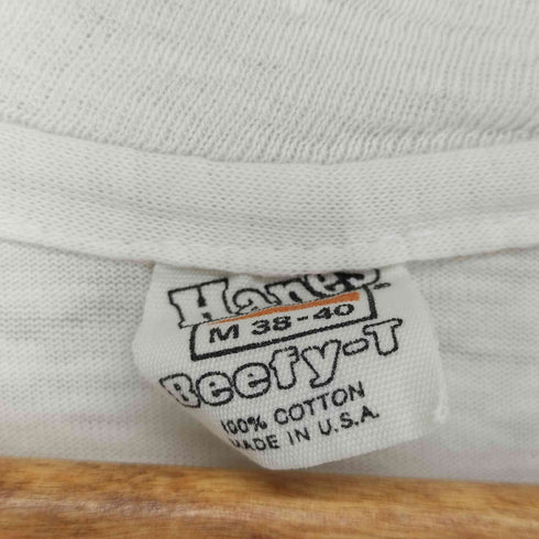 ヘインズ Hanes 80s USA製 オレンジタグ 袖裾シングル フロントプリントクルーネックTシャツ メンズ JPN:M