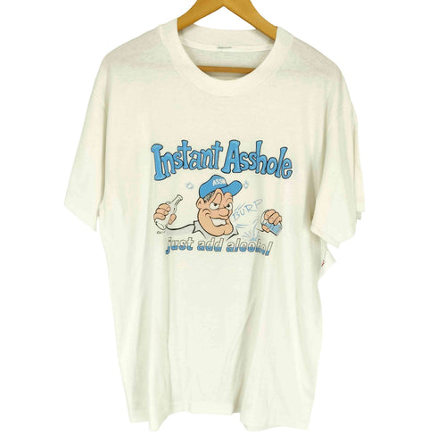 INSTANT ASSHOLE ©1991 袖裾シングル フロントプリントクルーネックTシャツ メンズ
