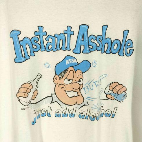 INSTANT ASSHOLE ©1991 袖裾シングル フロントプリントクルーネックTシャツ メンズ