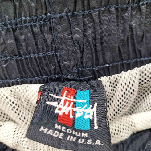 ステューシー Stussy OLD USA製 ショーンフォント リフレクター ナイロントラックパンツ メンズ M