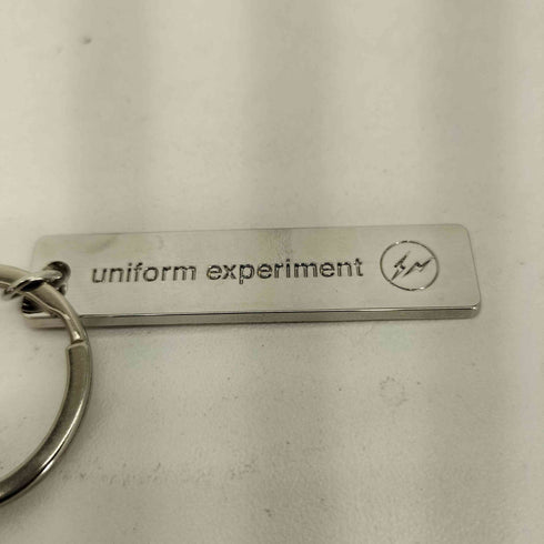 ユニフォームエクスペリメント uniform experiment × 吉田ユニ MUD DOLL マッドドール アクリルキーホルダー メンズ