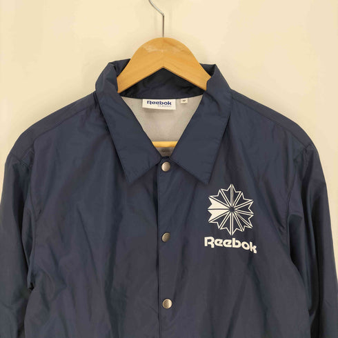 リーボッククラシック REEBOK CLASSIC ロゴ両面プリント 裏地フリース ドローコード コーチ ジャケット メンズ import:M