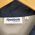 リーボッククラシック REEBOK CLASSIC ロゴ両面プリント 裏地フリース ドローコード コーチ ジャケット メンズ import:M