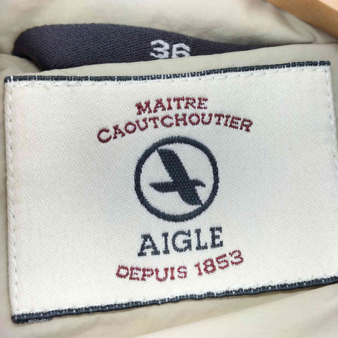 エーグル AIGLE フェイクファー付きフーデッドロングダウンコート レディース 36