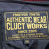 クラクトワークス Cluct Works 裾ロゴパッチ チェック柄 裏地キルティング ジップアップ ウール ナイロン ジャケット メンズ JPN:M