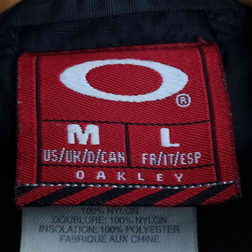 オークリー OAKLEY 90S オーバルロゴ スイッチング パテッドベスト メンズ import:M
