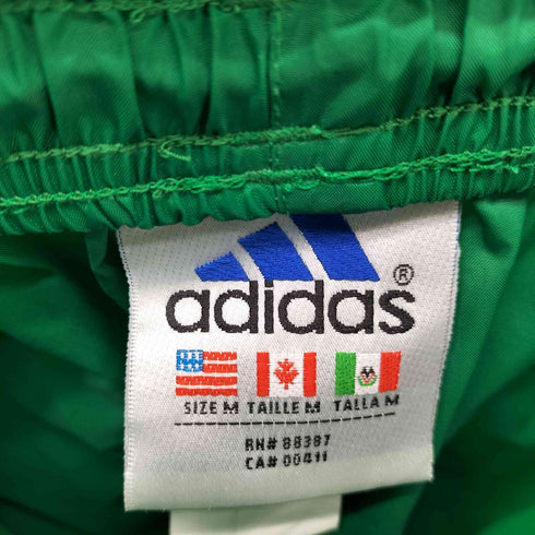 アディダス adidas 90S 万国旗タグ パフォーマンスロゴ イージー ナイロン ジョガーパンツ 裾ジップ メンズ