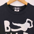 ブラックコムデギャルソン BLACK COMME des GARCONS 22ss 人型 ロゴプリント クルーネック 半袖Tシャツ メンズ JPN:XS