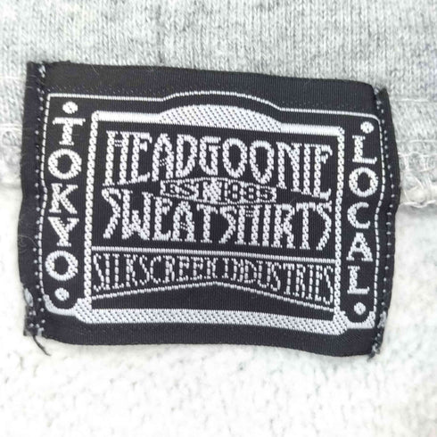 ヘッドグーニー HEADGOONIE キャラクタープリント プルオーバーパーカー NEW WORLD ORDER メンズ