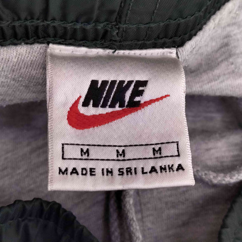 ナイキ NIKE 90s 白タグ 裾ジップ サイドライン スウォッシュ刺繍 トラックパンツ メンズ  M