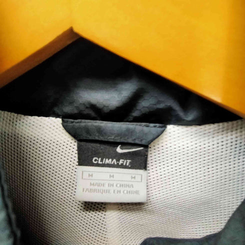 ナイキ NIKE 00S 袖スウッシュ 刺繍 裏地メッシュ パイピング ウィンドブレイカー テック ブルゾン 裾ドローコード レディース import:M