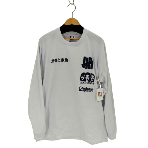 アンディフィーテッド UNDEFEATED Chelsea Drugstore Gente Unida L/S TEE メンズ import:XL