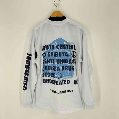 アンディフィーテッド UNDEFEATED Chelsea Drugstore Gente Unida L/S TEE メンズ import:XL