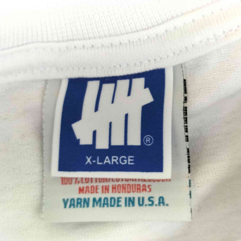 アンディフィーテッド UNDEFEATED Chelsea Drugstore Gente Unida L/S TEE メンズ import:XL