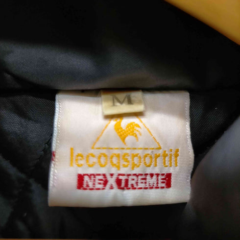 ルコック スポルティフ le coq sportif NEXTREME 両面ロゴ刺繍 裏地キルティング 中綿 ショルダーライン フルジップ ブルゾン 裾ドローコード メンズ import:M
