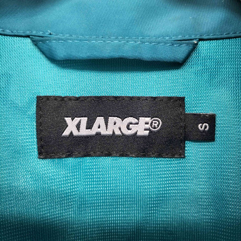 エクストララージ XLARGE ALL OVER LOGO TRACK JKT メンズ JPN:S