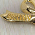 モスキーノ MOSCHINO ゴールドリボン ブローチ レディース