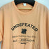 アンディフィーテッド UNDEFEATED フロントプリント S/S Tシャツ メンズ import:XL
