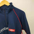 アンブロ UMBRO ハーフジップ ラグラン 裾ドローコード トラックトップ メンズ JPN:XL
