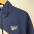リーボック Reebok LE TRACKTOP TBC PW ナイロンジャケット メンズ import:L
