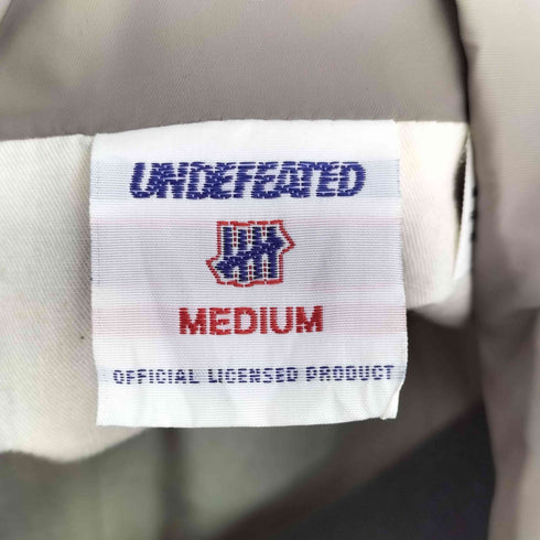 アンディフィーテッド UNDEFEATED ロゴプリント ナイロンコーチジャケット メンズ JPN:M