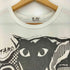 プレイコムデギャルソン PLAY COMME des GARCONS ×TARO OKAMOTO 総柄 クルーネック 半袖 Tシャツ メンズ JPN:L