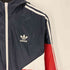 アディダスオリジナルス adidas Originals トレフォイルロゴ プリント 裏地メッシュ マルチカラー ウインドブレーカー フーデッド ジャケット メンズ JPN:M