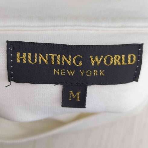ハンティングワールド HUNTING WORLD 2025 SHOGO SEKINE コラボ タイポグラフィ イラストデザイン 半袖Tシャツ メンズ import:M