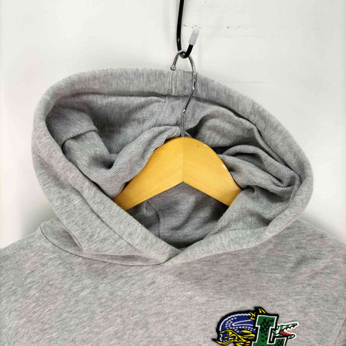ラコステ LACOSTE コミックグラフィックスウェットパーカ メンズ import:S