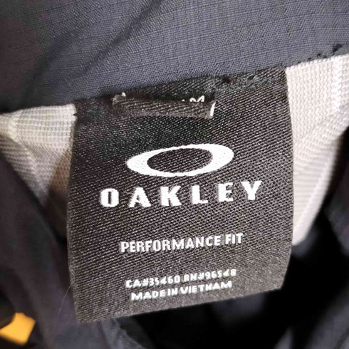 オークリー OAKLEY PERFORMANCE FIT バイカラー リップストップ オーバルロゴ マウンテンジャケット メンズ JPN:L