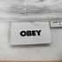 オベイ OBEY ロゴ 刺繍 霜降り ジップパーカー メンズ L
