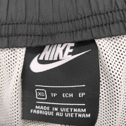 ナイキ NIKE ナイロンパンツ サイドボタン ウィンドランナー メンズ JPN:XS