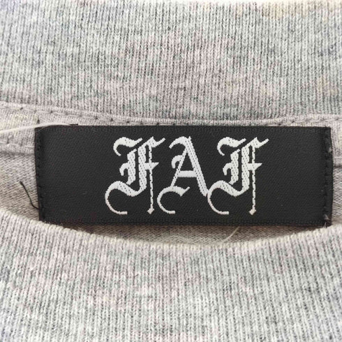 エフエーエフ/フェイクアズフラワーズ FAF/Fake As Flowers COOPERATIVE MININGプリント クルーネックTシャツ メンズ import:S